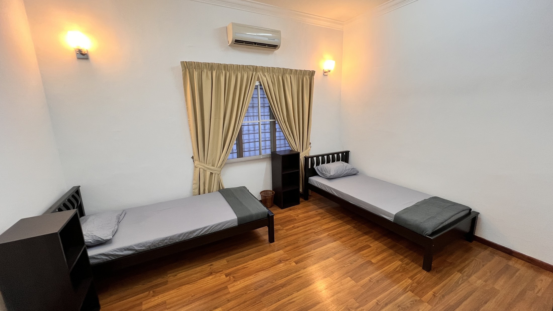 Twin bedroom with warm lighting